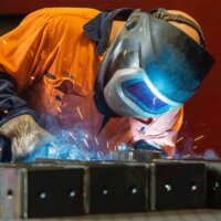 about-bg Laser Cutting Brisbane worker making custom project